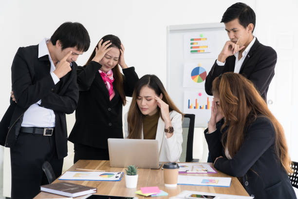 istock Team of business people are stressed about work 1188519580