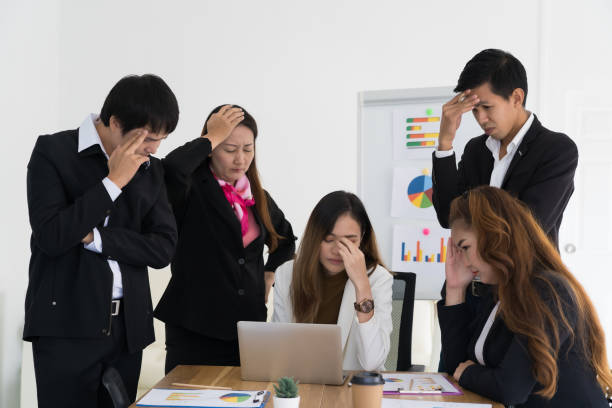 istock Team of business people are stressed about work 1188519581