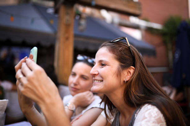 istock Woman video chatting at restaurant 1188520677