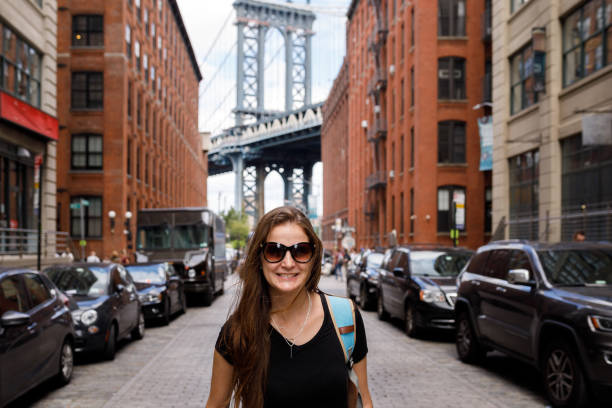 istock Woman posing in front of Manhattan Bridge 1188520679