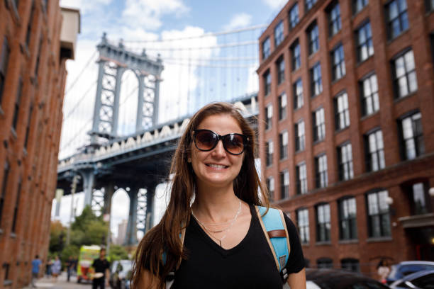 istock Woman posing in front of Manhattan Bridge 1188520696