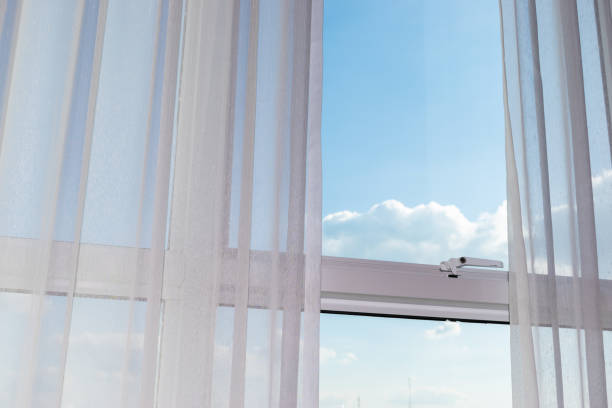 istock white curtain on glass window 1188527597
