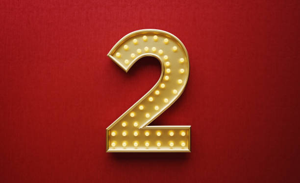 istock Light Bulbs Forming Number Two on Red Background 1188530394