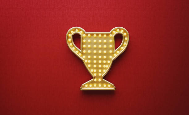 Light bulbs forming a trophy symbol on red background. Horizontal composition with copy space.