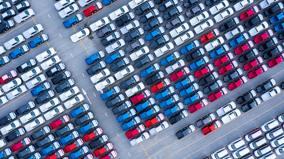 Aerial view new cars for sale stock lot row, New  Cars dealer inventory import export business logistic global.