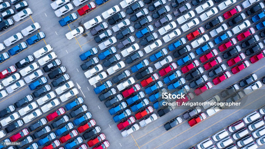 Aerial view new cars for sale stock lot row, New  Cars dealer inventory import export business logistic global. Car Stock Photo