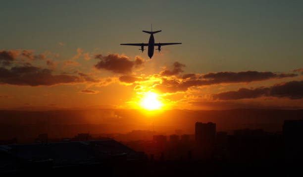 istock The plane flies off into the sunset. 1188534330