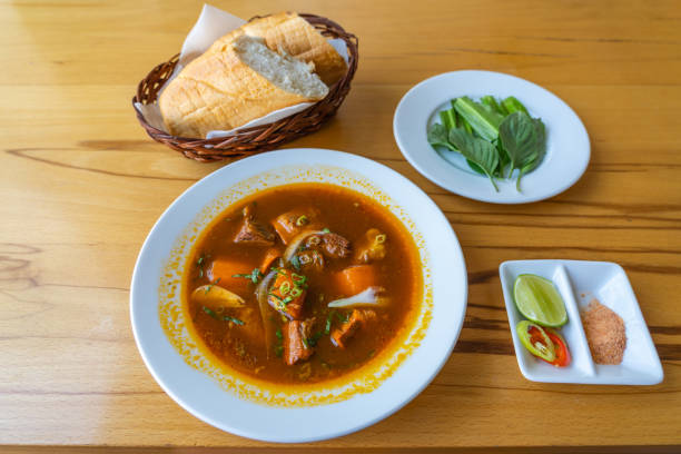 istock Bo kho- Vietnamese braised beef served with bread and vegetables 1188540745