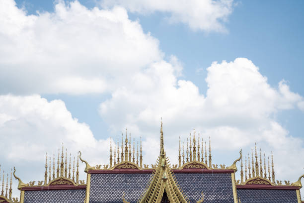 on a sunny day in Thailand, with an exceptionally beautiful roof of a large temple