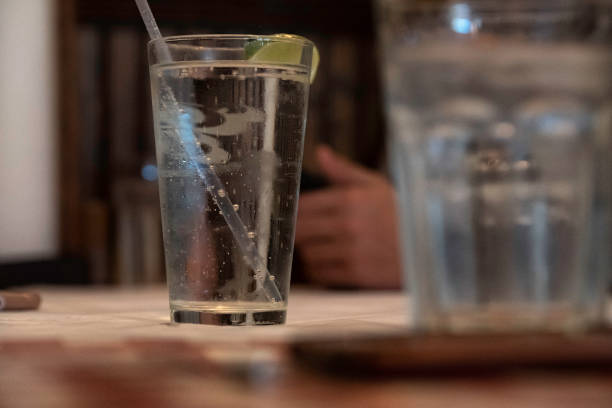 istock Glass of water with ice in restaurant background. 1188549470