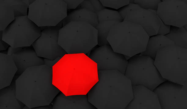 istock Red Umbrella Between The Black Umbrellas 1188549510