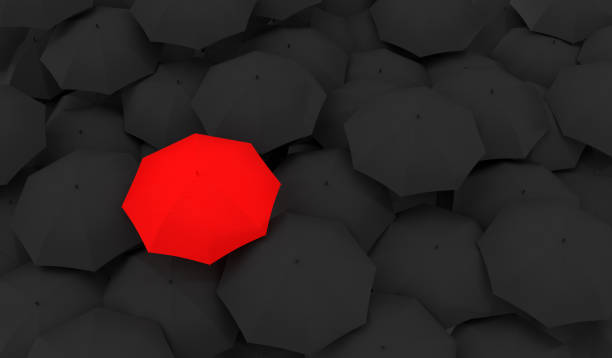 istock Red Umbrella Between The Black Umbrellas 1188549514