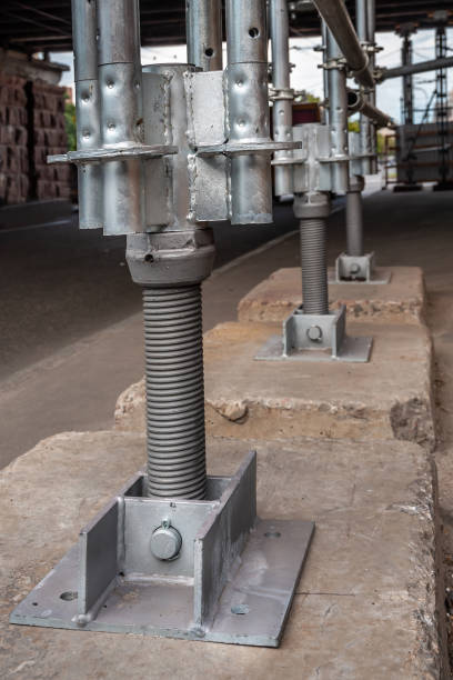 istock Heavy-duty pylons support a destroyed bridge beam 1188551100