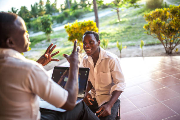 African teenager  using a laptop