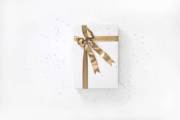 istock White gift box with gold ribbon bow 1188552728