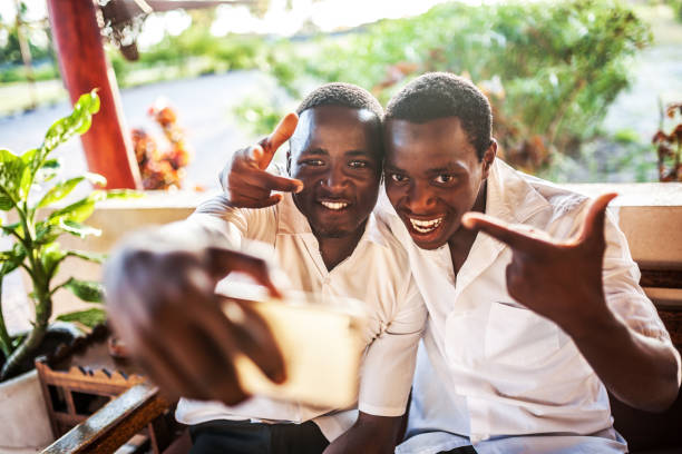 istock African teenager with mobile 1188552942