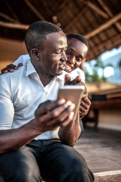 istock African teenager with mobile 1188552946