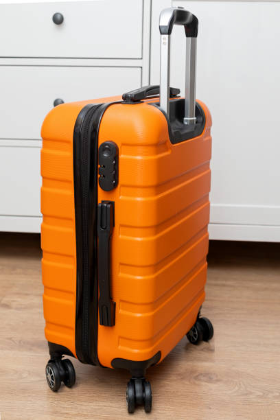istock Orange travel suitcase 1188559467