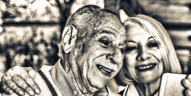 istock Active elderly couple outdoor using mobile phone 1188560242