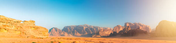 istock Panoramic Approach to Wadi Rum - Red Desert by Morning Golden Hour 1188561868