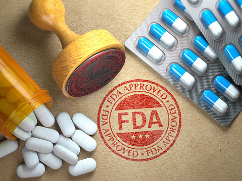 FDA approved  concept. Rubber stamp with FDA and pills on craft paper. 3d illustration