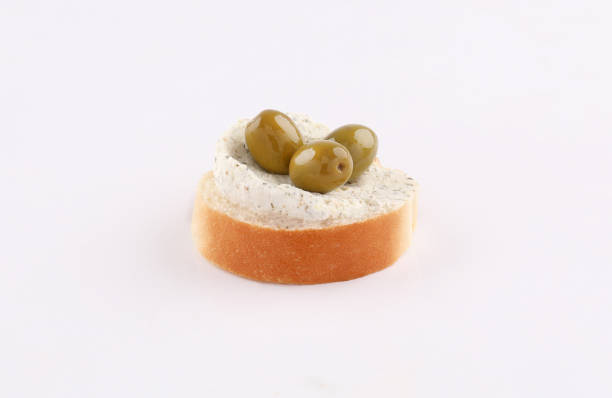 opened sandwich appetizer, Bruschetta, tapas, canape with various topping, ham, mortadella, tuna, cucumber, olives on white background