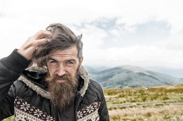 istock bearded handsome serious man on mountain top 1188571910