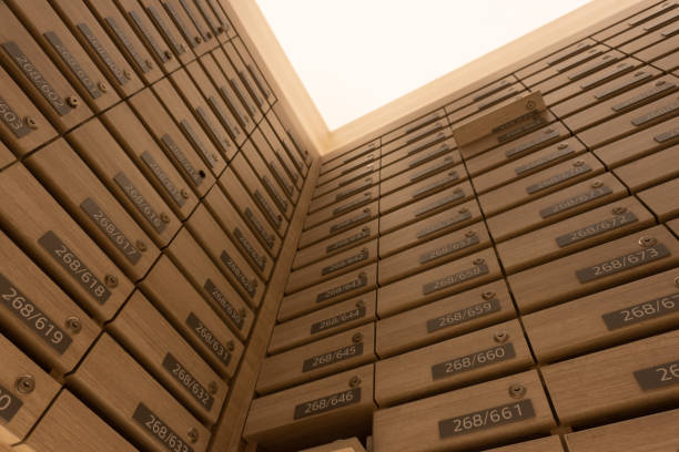 istock Numbered mailboxes and lockers in raw in the condo. Natural wooden letterbox panel pattern , view from bottom, from down into up 1188572251