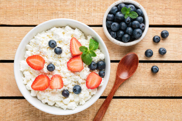 istock Cottage cheese or curd cheese with berries 1188577210