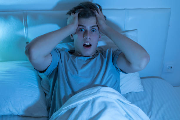 istock Young man angry from not being able to sleep on bed 1188582300