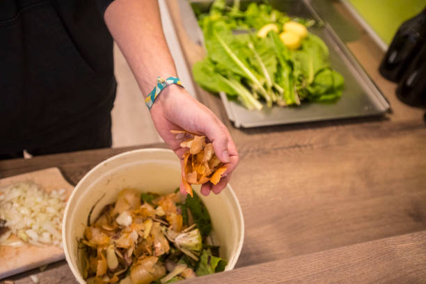 istock Chef Throwing Leftovers in a Bowl - Stock Photo 1188582682