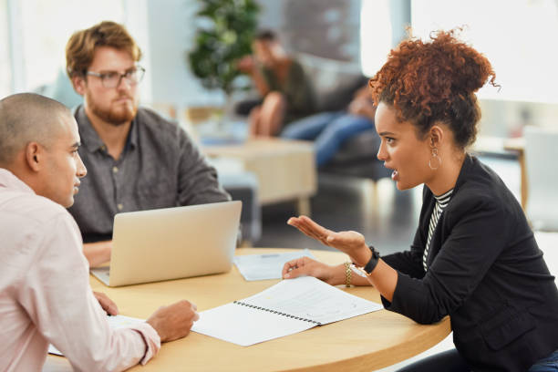 We're sitting with a big problem here Shot of a group of businesspeople having a meeting in an office arguing stock pictures, royalty-free photos & images