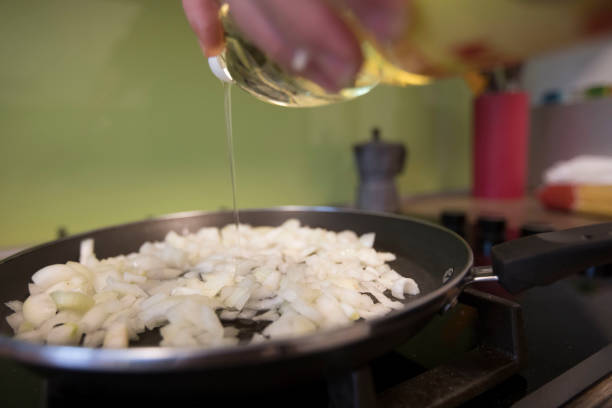 istock Adding Oil for Roasting Onions - Stock Photo 1188584399
