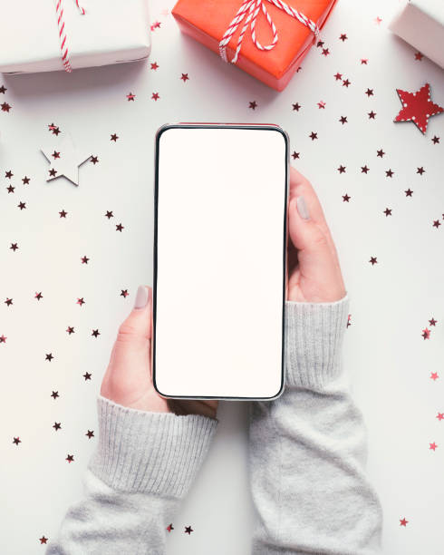 istock Close up of modern cellphone with blank screen for online app 1188585389