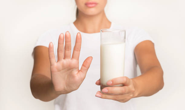 istock Unrecognizable Woman Holding Milk Standing Gesturing No, Studio 1188585493