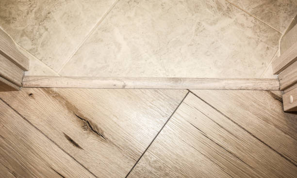 istock Installation of threshold indoors. Renovation works in the flat. 1188586192