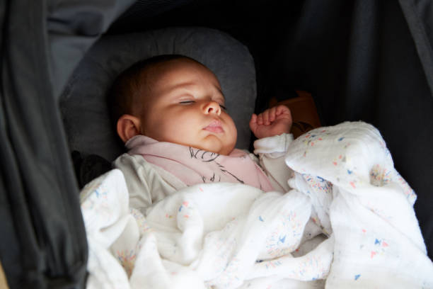 Close Up Of Baby Girl Asleep In Detachable Seat Close Up Of Baby Girl Asleep In Detachable Seat detachable stock pictures, royalty-free photos & images