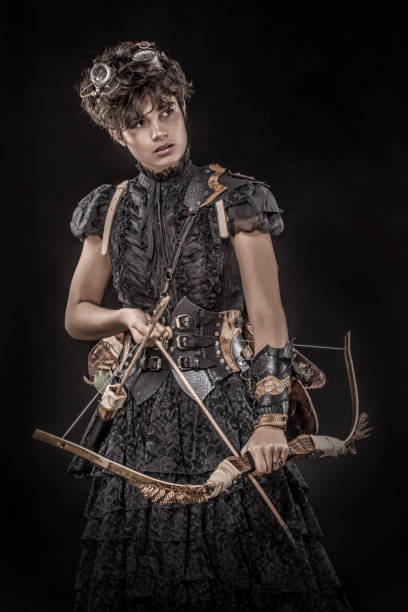 istock Steampunk female archer in a studio shot 1188590298