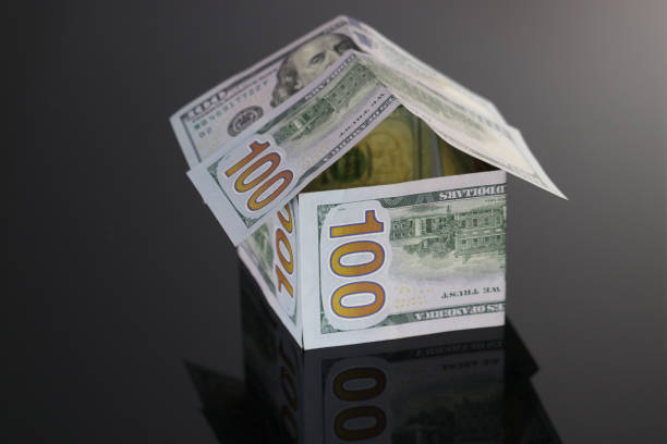 istock House made of dollar banknotes. 1188590477