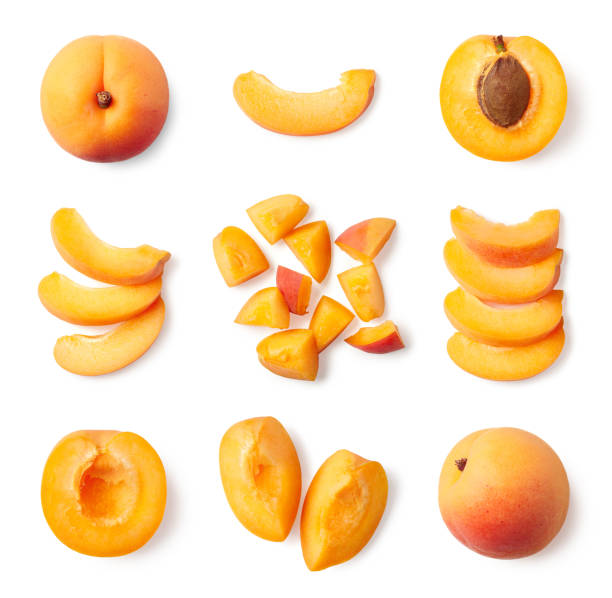 Set of fresh whole and sliced apricot Set of fresh whole and sliced apricot isolated on white background, top view halved photos stock pictures, royalty-free photos & images