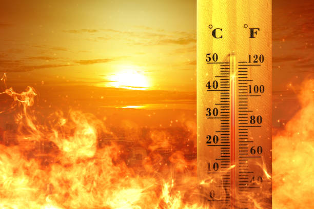 istock Thermometer with high temperature on the city with glowing sun background 1188593194
