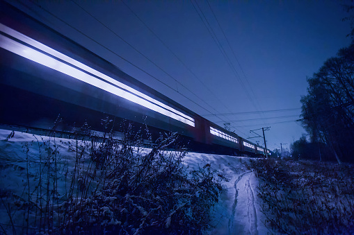 A view of a railroad crossing in downtown Tokyo that evokes a sense of nostalgia in the evening.