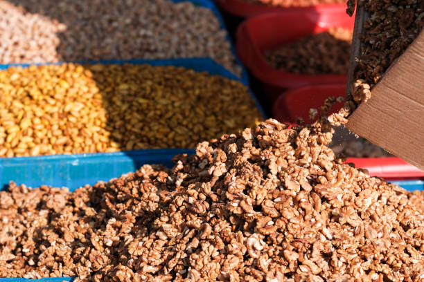 istock walnuts close up. nuts on the market are on the counter. 1188594735