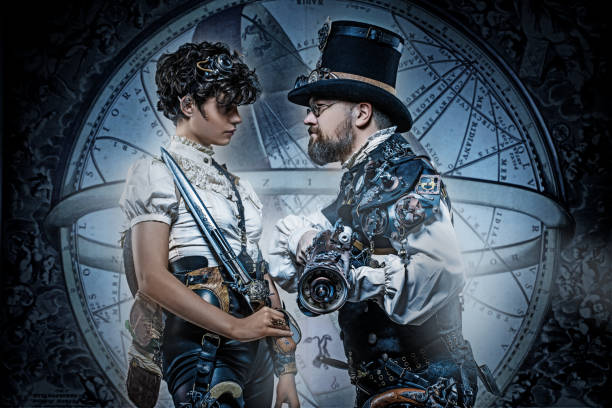 Steampunk couple in a studio shot Steampunk couple of male and female enthusiasts in a studio shot steampunk pistol pictures stock pictures, royalty-free photos & images