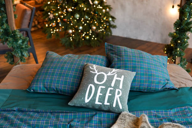 istock christmas tree in bedroom , new year home interior 1188601383