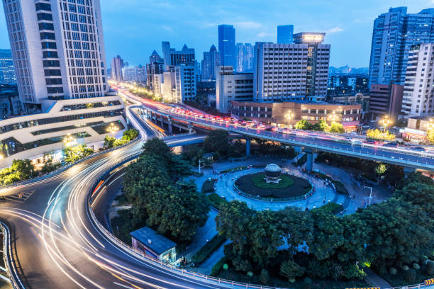 istock The light trails on the modern building background in shanghai china. 1188603859