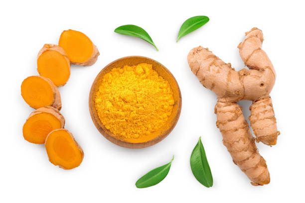 Turmeric powder and turmeric root isolated on white background. Top view. Flat lay