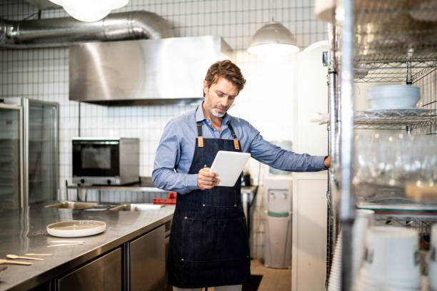 istock Business owner checking kitchen supplies 1188606471