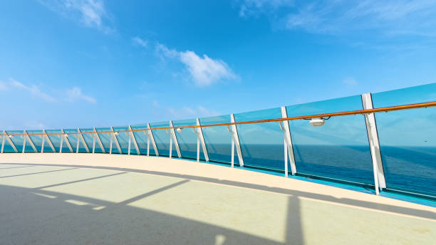 istock Cruise Ship Deck and railing with Ocean View in sunny day, blue sea and blue sky background. 1188608055