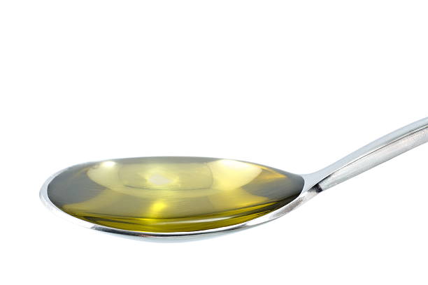 Spoon of oil stock photo